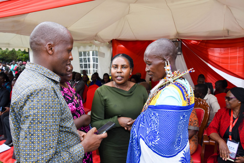Community members in conversation at a local gathering