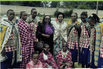 Community members in traditional dress standing together