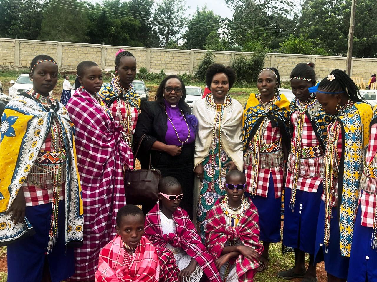 Community members in traditional dress at a foundation gathering